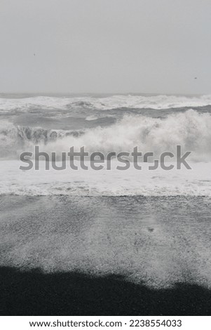 Sea waves white foam on coast monochrome landscape photo. Beautiful nature scenery photography with sky on background. Idyllic scene. High quality picture for wallpaper, travel blog, magazine, article