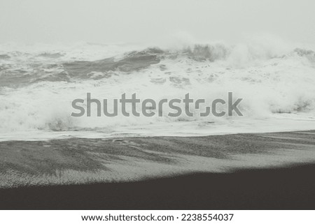 Stormy weather on sea monochrome landscape photo. Beautiful nature scenery photography with foamy waves on background. Idyllic scene. High quality picture for wallpaper, travel blog, magazine, article