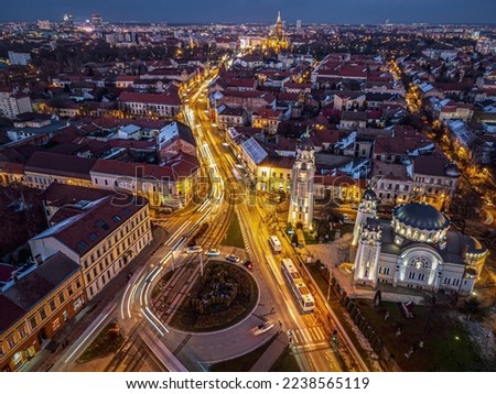 Aerial view of Timisoara’s lights and decorations on Sinaia plaza and the Iosefin Orthodox church. Photo taken on 12th of December 2022 in Timisoara, Timis county, Romania. Royalty-Free Stock Photo #2238565119