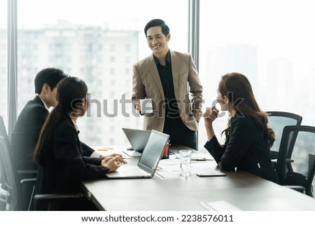 image of a group of Asian businessmen working together at the company
