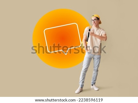 Male Asian student and blank speech bubble on color background