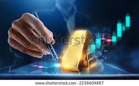 Rising gold prices concept. Investment in precious metals in the stock market Royalty-Free Stock Photo #2238604887