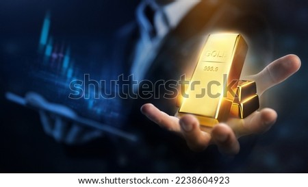 Rising gold prices concept. Investment in precious metals in the stock market Royalty-Free Stock Photo #2238604923