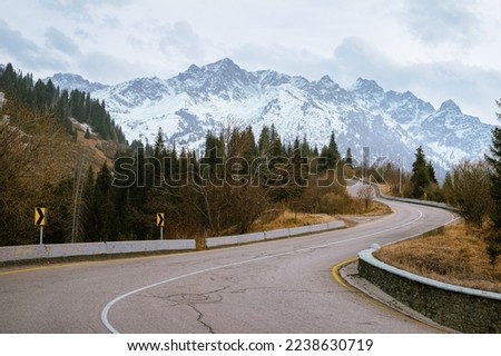 A dangerous winding road among the mountains. The way to the ski resort of Chimbulak. Mountain peaks. Almaty. Kazakhstan