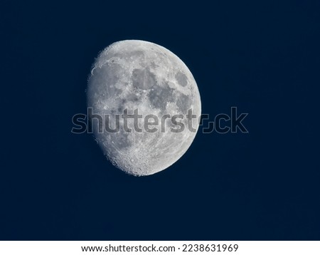 crescent gibbous moon,with blue background