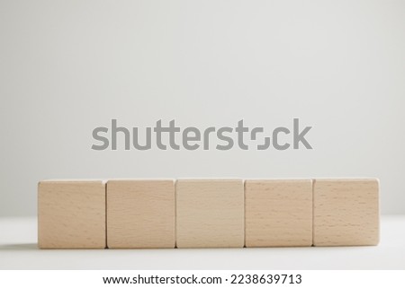 Banner,wallpaper,background,mock up concept.,Five Blank wooden cubes for put text or logo on white background.,Flat lay mock-up item concept.