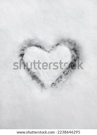 A heart-shaped picture drawn on snow