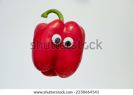 selected focus googly eyes on red bell pepper isolated on a white background Royalty-Free Stock Photo #2238664541