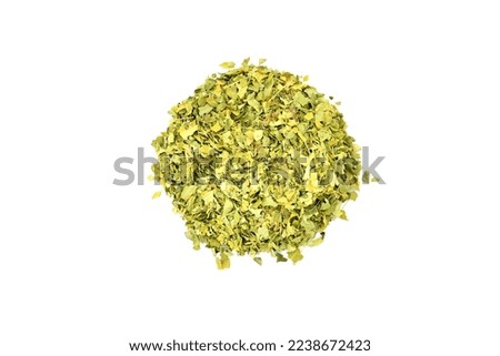 Dried Organic Moringa Leaves on white background. dehydrated Moringa Leaves Stock Photos and Images. coarse cuts. Moringa tea ingredients. herbal ingredients. Moringa tea.