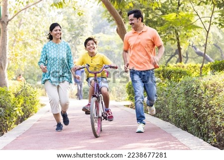 Happy family having fun at park