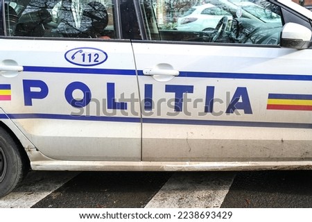 Police patrol car in Romania with flashing lights. Side view of a police car with the lettering "Police".