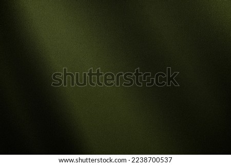 Brown green cloth. Gradient. Olive colors. Dark shade. Abstract background for design. Creases in fabric. Drape.