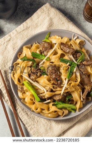 Homemade Beef Chow Fun Asian Noodles with Scallions Royalty-Free Stock Photo #2238720185