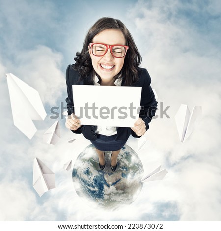 Top view of businesswoman holding white blank banner. Elements of this image are furnished by NASA