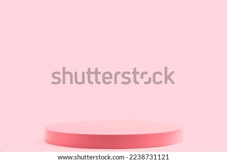 Empty round pink platform podium on pink background. Minimal creative composition background for cosmetics or products presentation