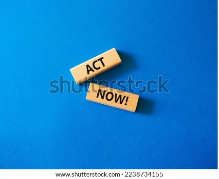 Act now symbol. Wooden blocks with words Act now. Beautiful blue background. Business and Act now concept. Copy space.