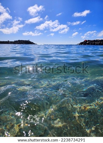 Aquatic Serenity: Immersed Horizon View from Turquoise Waters, Reveling in the Tranquil Beauty of a Gorgeous Blue Beach Paradise Royalty-Free Stock Photo #2238734291