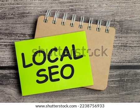 LOCAL SEO wording on a green sticker and notepad
