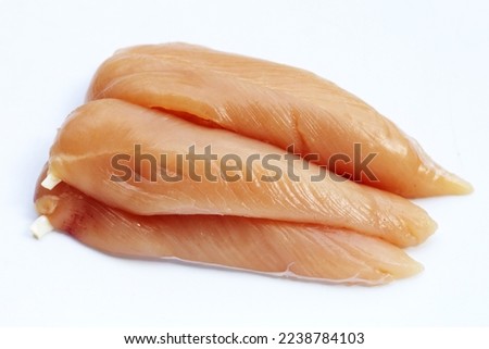 Raw chicken tenders on white background. Royalty-Free Stock Photo #2238784103