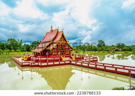 Traditional Thai style pavilion floating on the water with the placard in the front, written in Thai, means this pailion was built to commemorate the 2600 years aniversary of the Lord Buddha enlighten