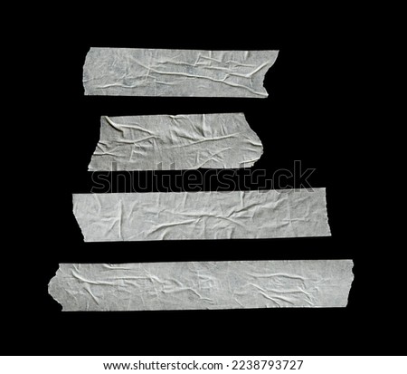 white masking tape torn isolated on a black paper backgrounds Royalty-Free Stock Photo #2238793727