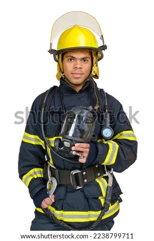 Young African American fireman with respirator and air breathing apparatus on his back in protective uniform isolated on white background.
