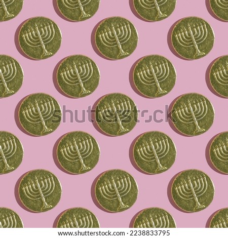 Seamless pattern with Hanukkah gelt on pink background.