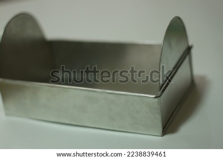stainless steel pan for baking isolated white background. empty aluminum pan.