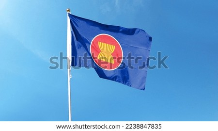 ASEAN Economic Community flag. Flying in the sky Royalty-Free Stock Photo #2238847835