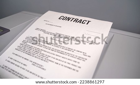 Concept: paper the contract is printed on the printer. Contract comes out of the printer. Contract sent by Fax