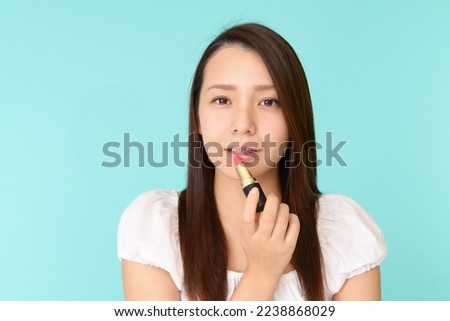 Young asian woman enjoying make-up
