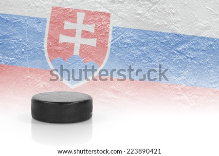 Hockey puck and the image of the Slovak flag. Concept