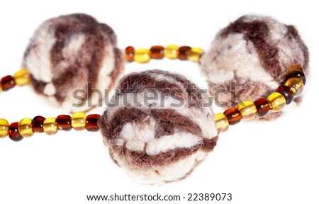 amber and wool necklace isolated on white