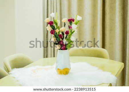 10th of ramadan,Egypt-  December 15th 2022-Picture of a cute home vase full of beautiful flowers on a table