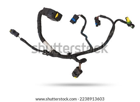 A cable of matted wires of different colors with connectors in the electrical wiring of the car. Internet line in the work of the provider. Royalty-Free Stock Photo #2238913603