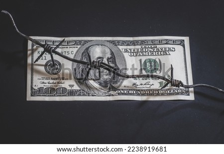 Dollar banknote with Barbed Wire, background economic crisis