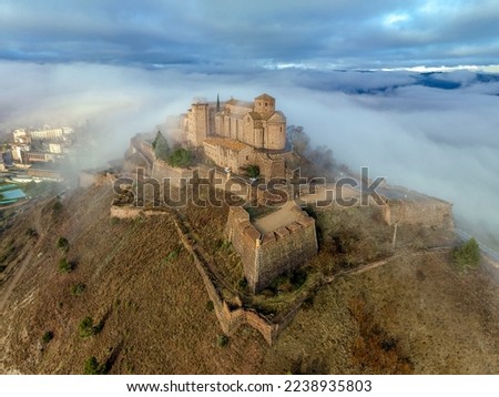Cardona castle is a famous medieval castle in Catalonia. Between very dense fog that hides the city