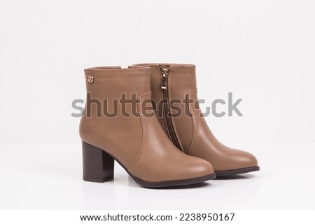 winter collection boots , high heels , shoes , white background 