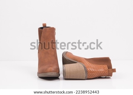 winter collection boots , high heels , shoes , white background 