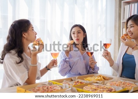 Cheers, Group of young asian office girl friends having fun and celebrating pizza on table during party