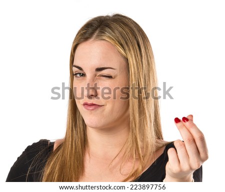Girl doing a money gesture over white background