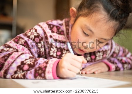 Girl studying seriously at home