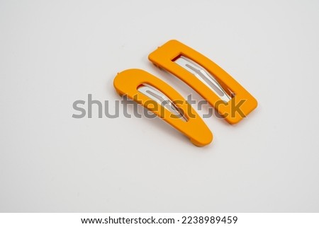 set of two yellow hair grips slides styles isolated on a white background Royalty-Free Stock Photo #2238989459