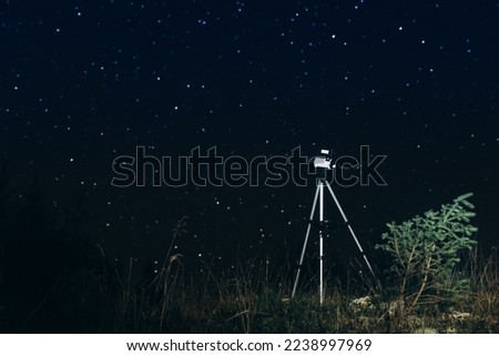 Modern telescope and beautiful sky in night outdoors. Learning astronomy