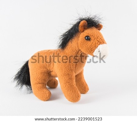 Plush horse on a white background. Children's soft toy.