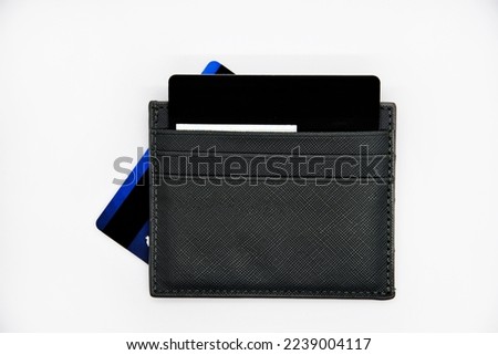 Plastic cardholder with bank cards on a white background. Wallet for plastic bank cards. Bank cards.
