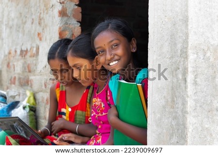 School Students Girls using laptop while studying at home Royalty-Free Stock Photo #2239009697