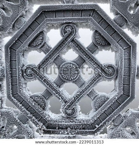 Fragment of a cast-iron lattice  on a bridge covered with hoarfrost