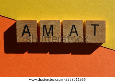 AMAT, acronym for All Mouth and Trousers, in wooden alphabet letters isolated on colourful background as banner headline