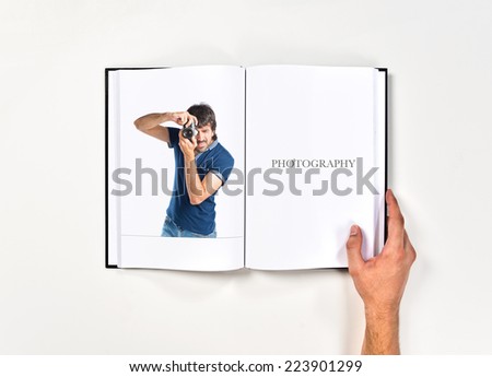 Man photographing printed on book